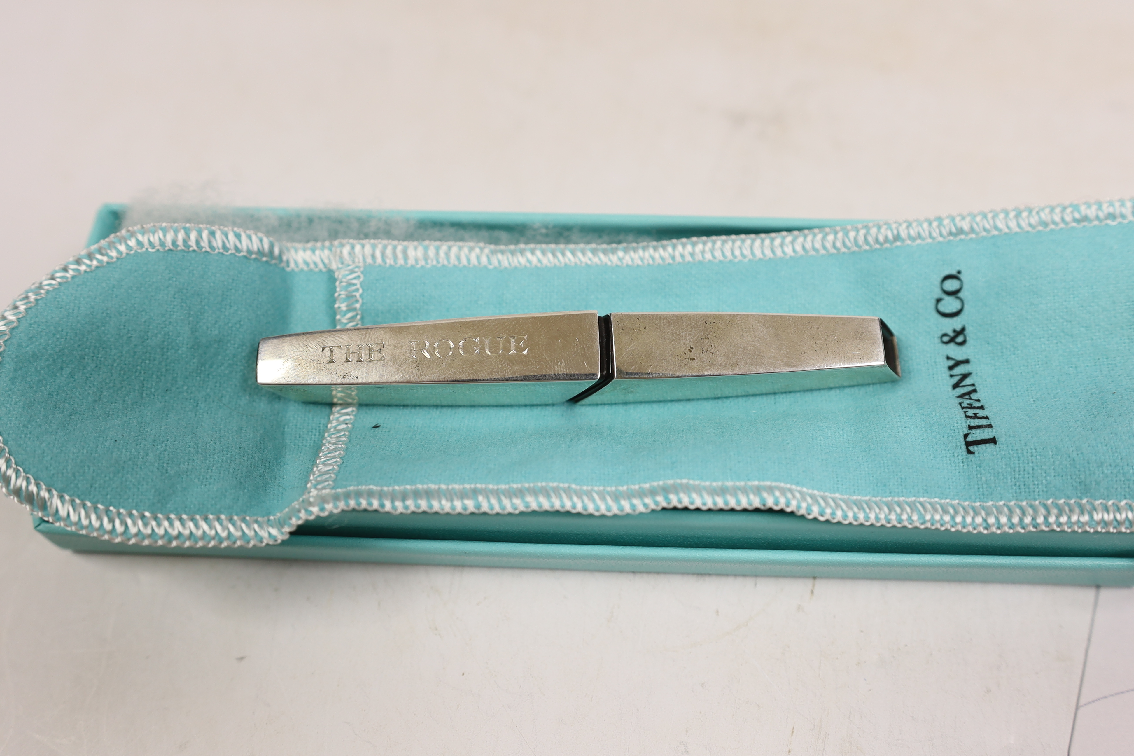 A modern Mexican 925 Tiffany & Co paper cutter, engraved 'The Rogue', 10.5cm, with Tiffany & Co pouch and box.